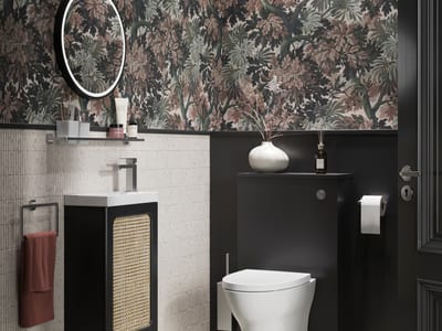 Cloakroom design Essex featuring brushed stainless steel fixtures and elegant compact styling - Bowman Bathrooms