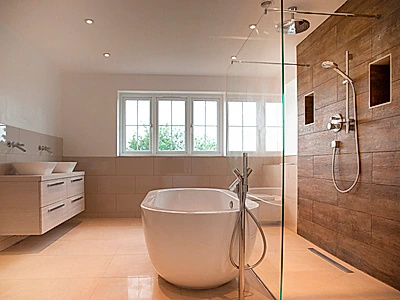 Frameless toughened glass shower wet room Axor chrome - Modern bathroom glass installation Essex luxury shower design Bowman Bathrooms