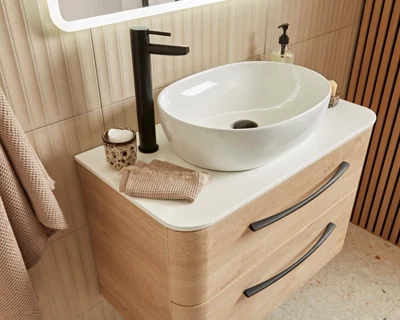 Modern bathroom with System Sand Oak vanity and contemporary fittings in an Essex installation by Bowmans