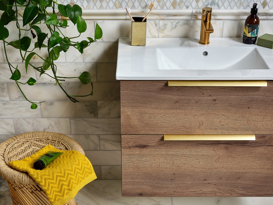 Ca Pietra Palazzo Oro range in brick-bond layout — warm gold-toned tile in a brick-bond pattern, an example of the boutique-supplier ranges with longer lead times that need ordering before strip-out begins