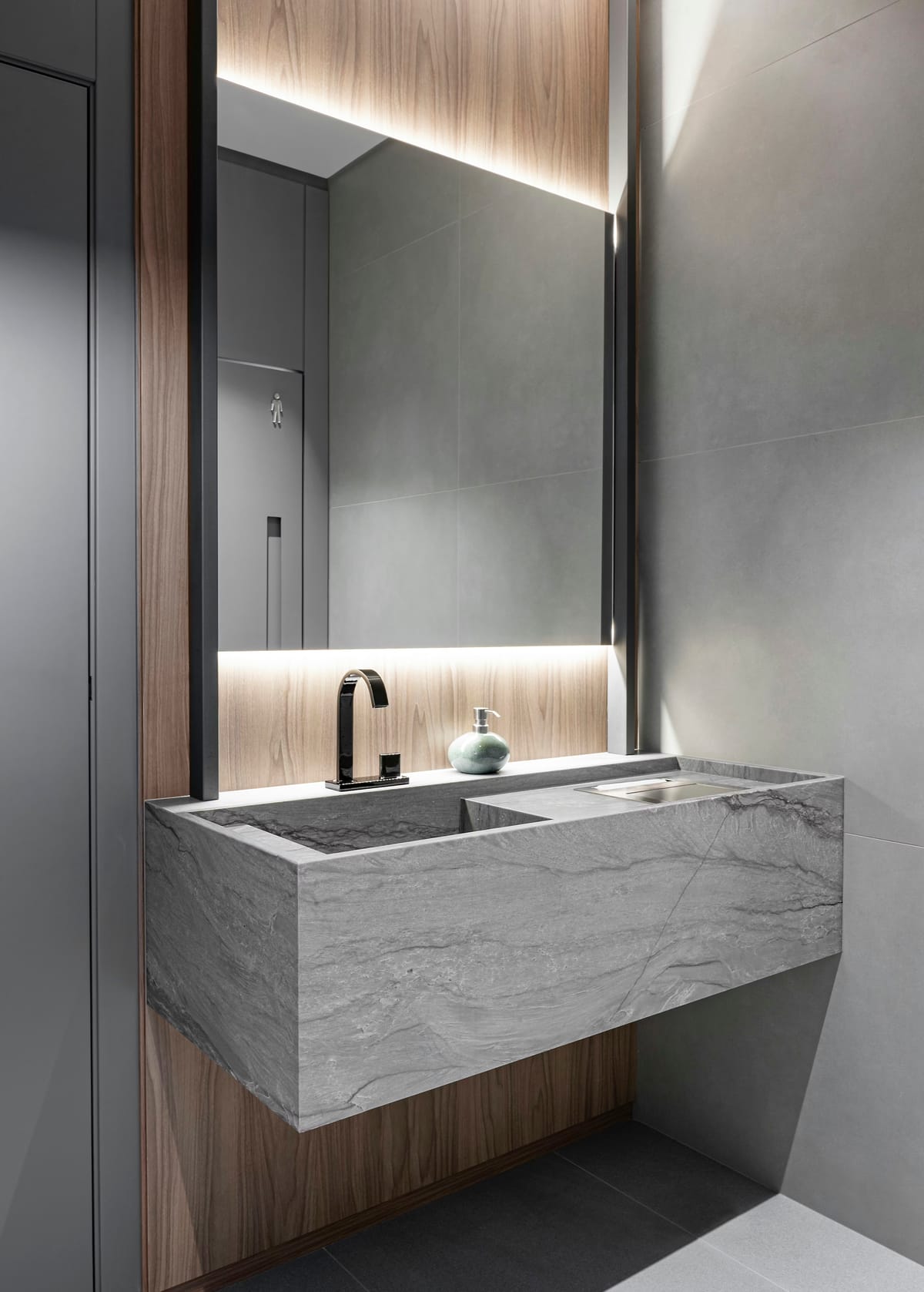 Cosentino Costa Azul surface formed into an integrated vanity and basin, with grey veining running across the front edge