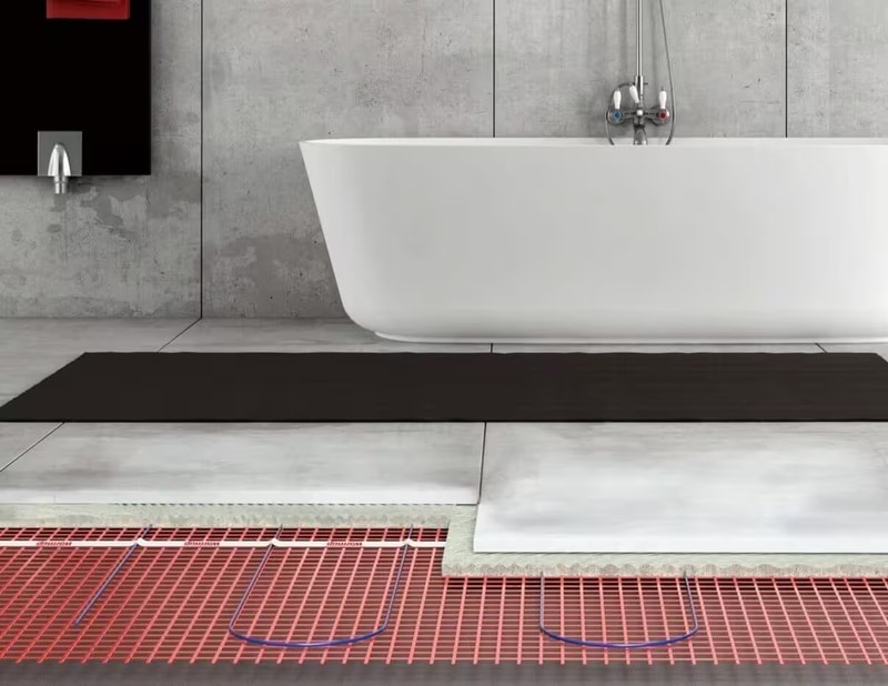Warmup heating mats installed beneath bathroom floor tiles in Essex
