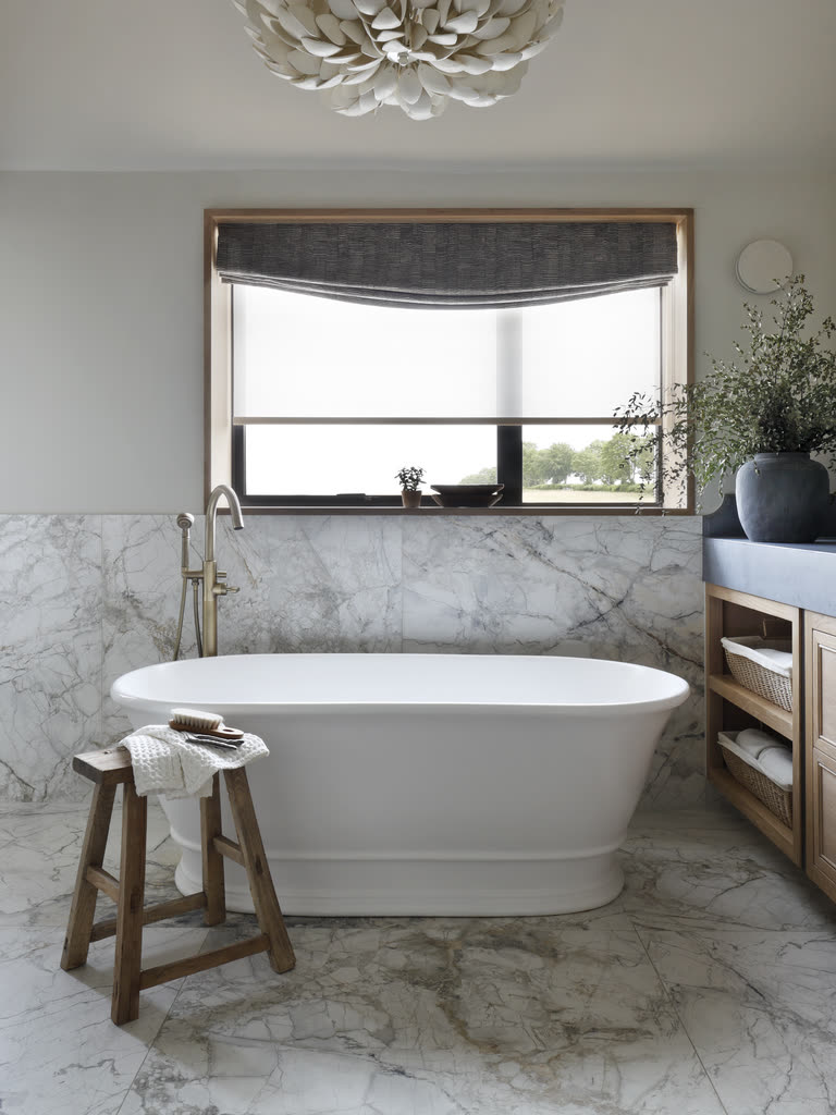 Luxury freestanding bath in a contemporary bathroom setting by BC Designs