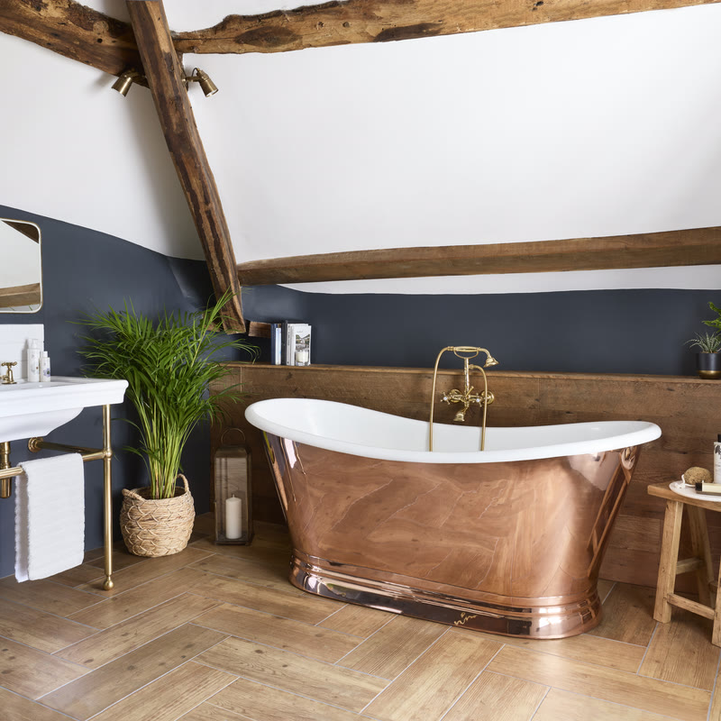 Editorial luxury bathroom scene with BC Designs BAC070 freestanding bath in soft natural light