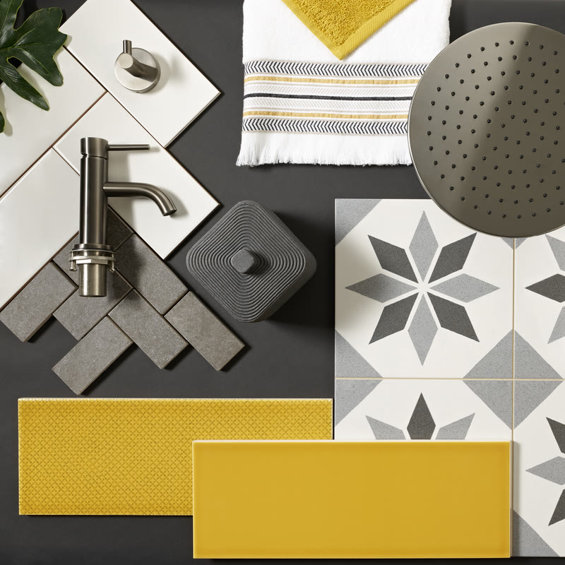 Bathroom design moodboard with brushed matt black fixtures, dark stone samples and tile swatches