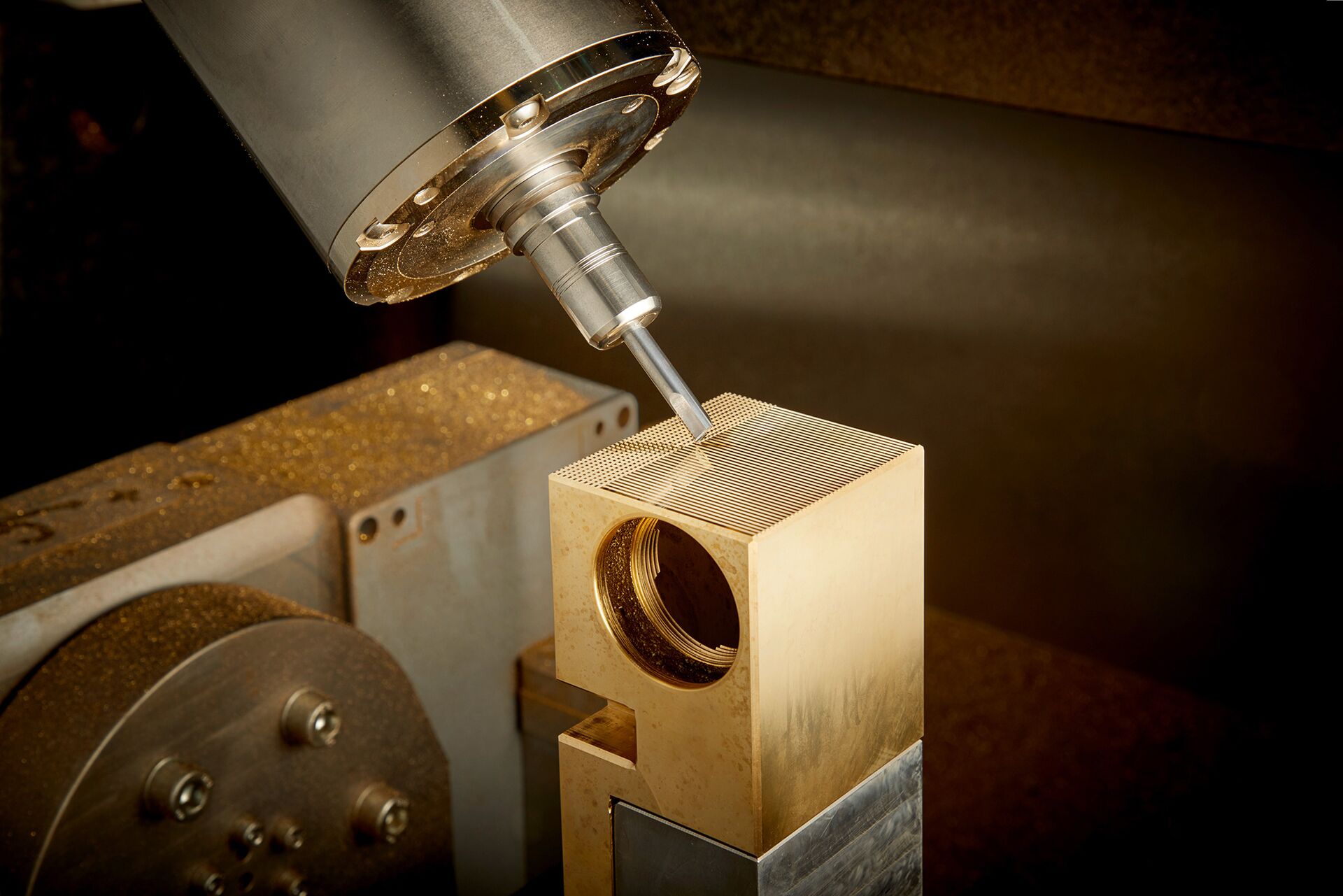 Diamond-tipped tooling refining the surface of an AXOR Edge mixer component