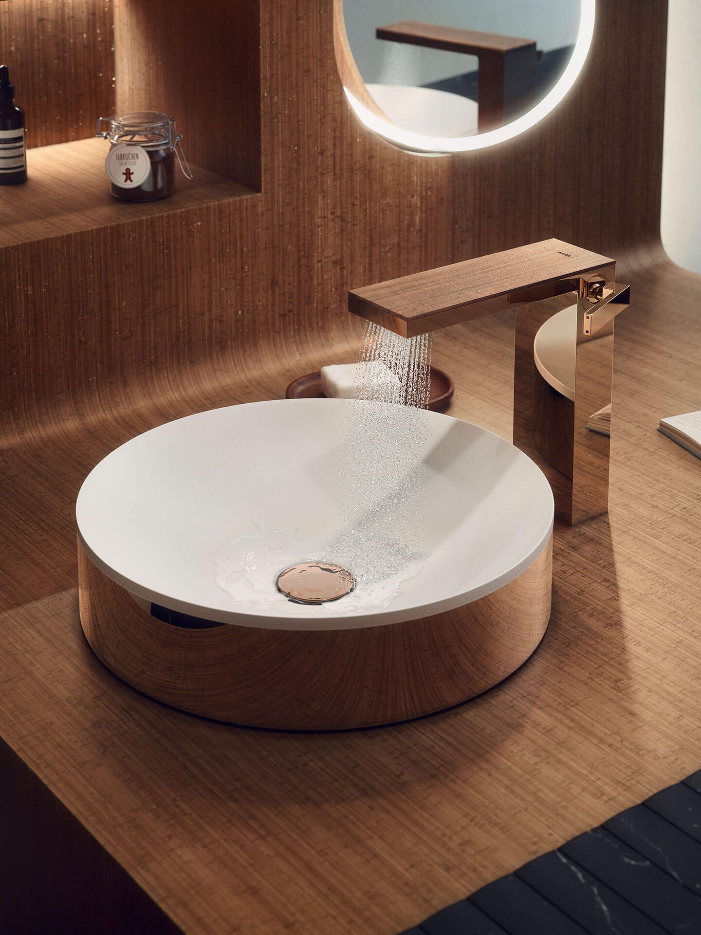 AXOR MyEdition in Polished Red Gold with walnut cover above a round AXOR Suite basin
