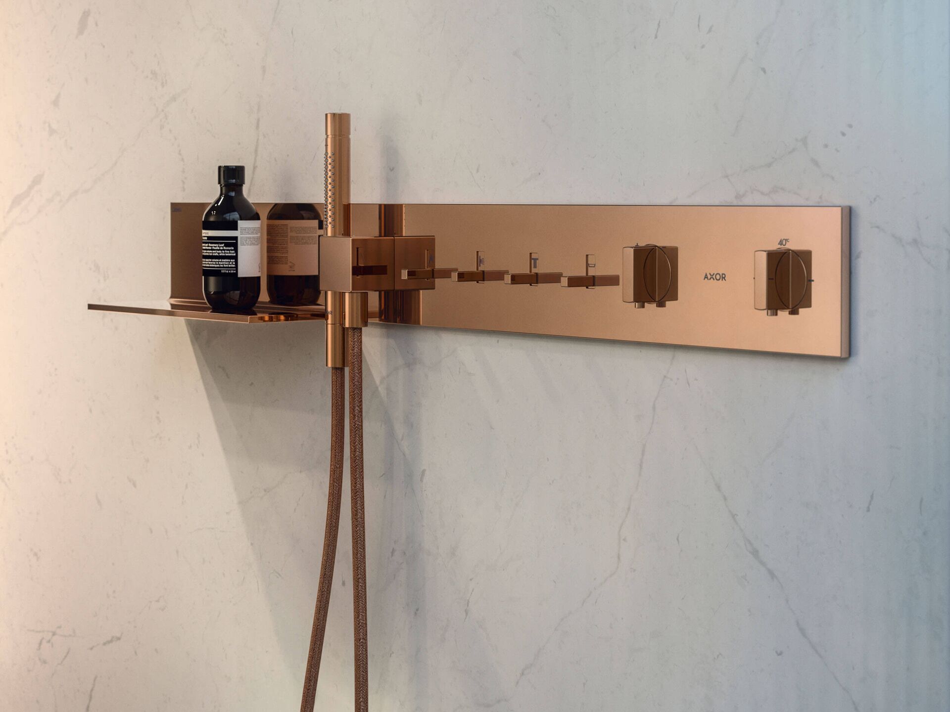 AXOR ShowerComposition horizontal control module with hand shower in Polished Red Gold