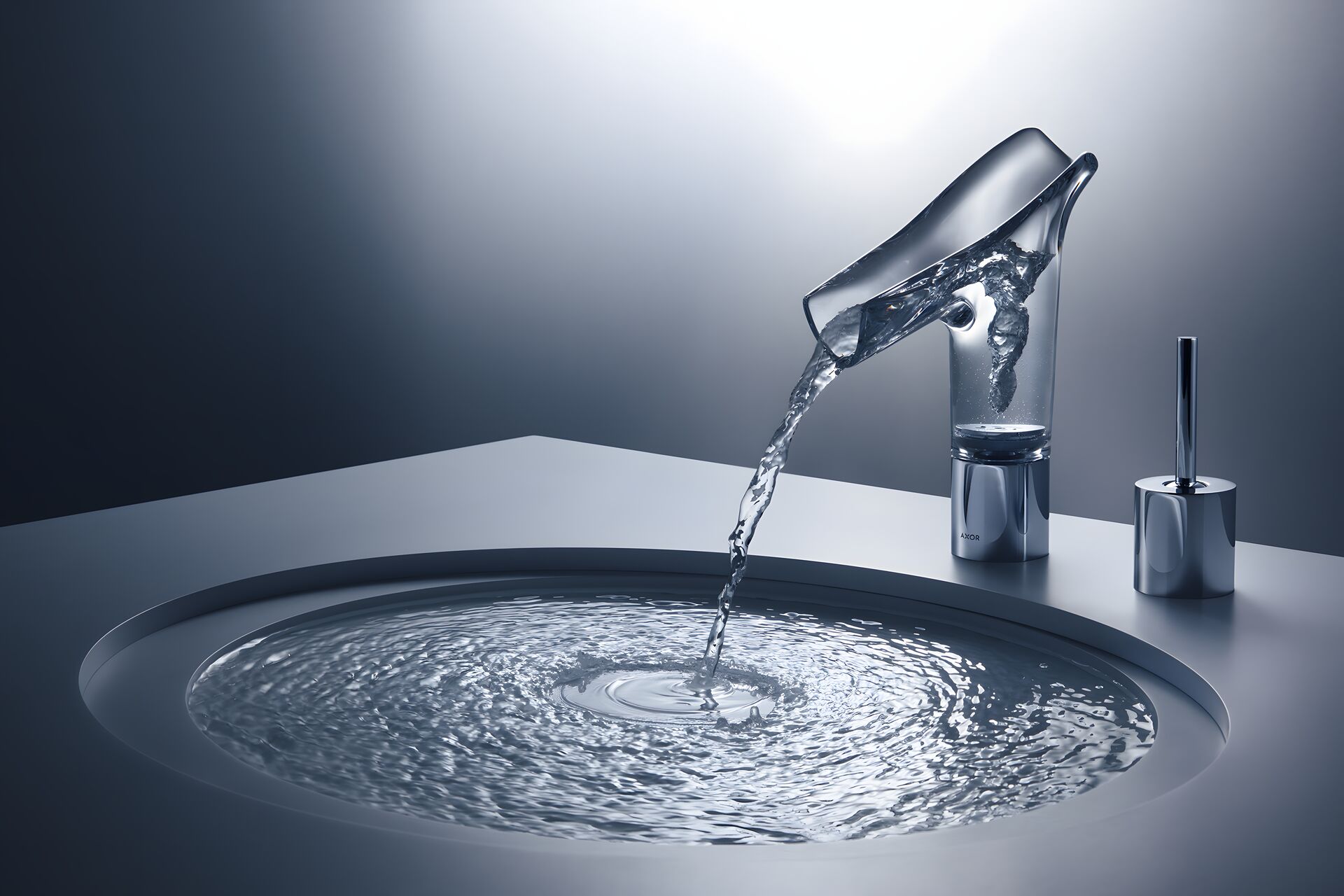 AXOR Starck V glass spout pouring into a circular basin beside a separate control
