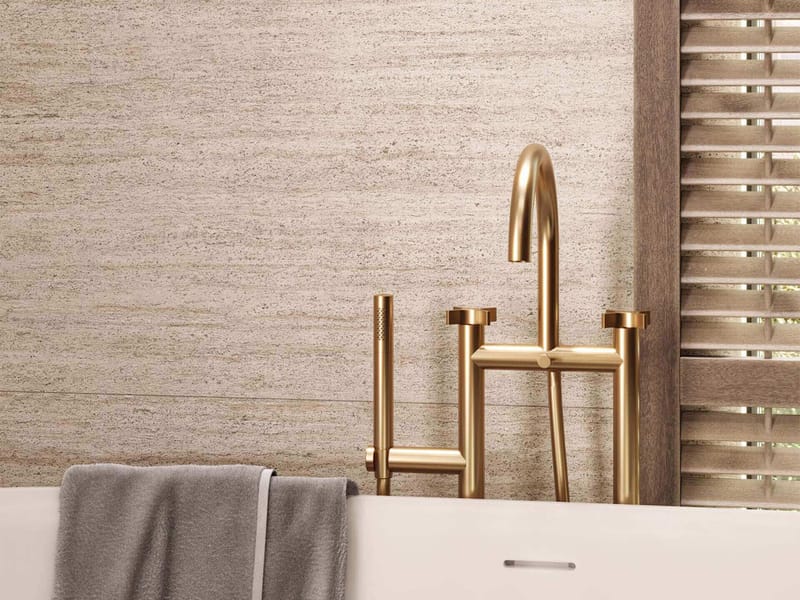 Neutral tone-on-tone tile palette in a small bathroom creating unified visual flow