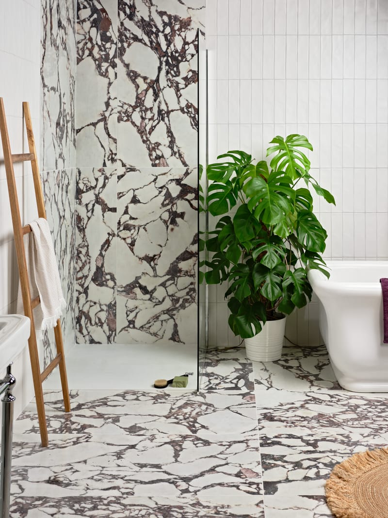Polished porcelain wall tiles in vertical stack layout adding height to a small bathroom