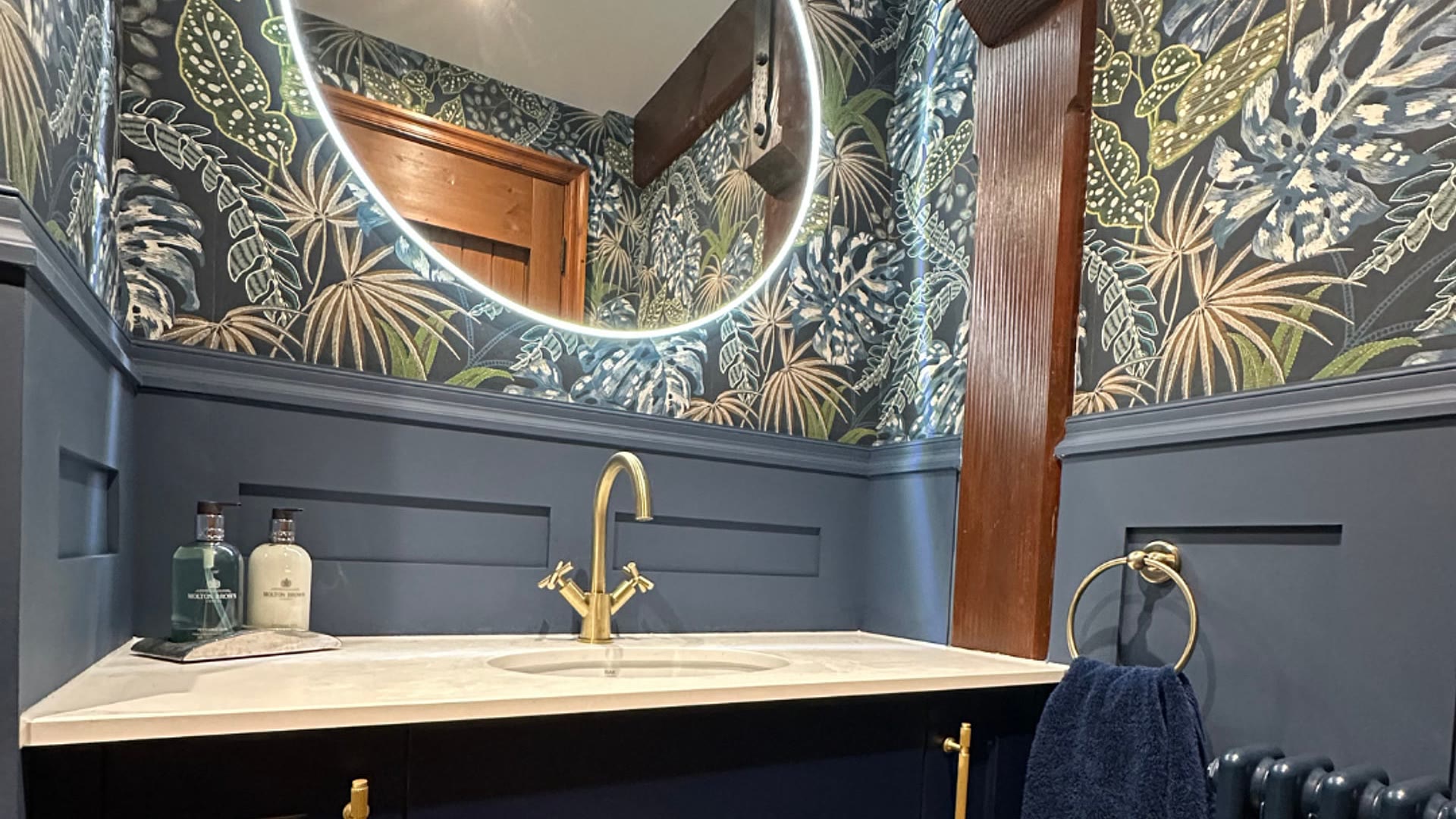 Navy Calypso vanity, brushed brass tap and illuminated mirror in a minimum-size downstairs toilet, Hatfield Peverel, Essex