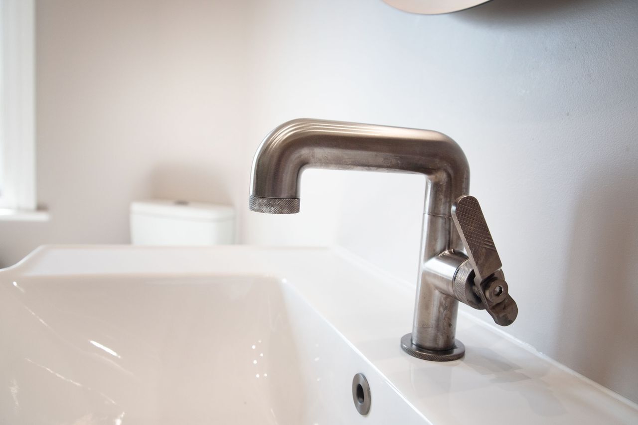 Crosswater Union basin mixer in brushed black on a white basin, Great Saling CM7 guest ensuite