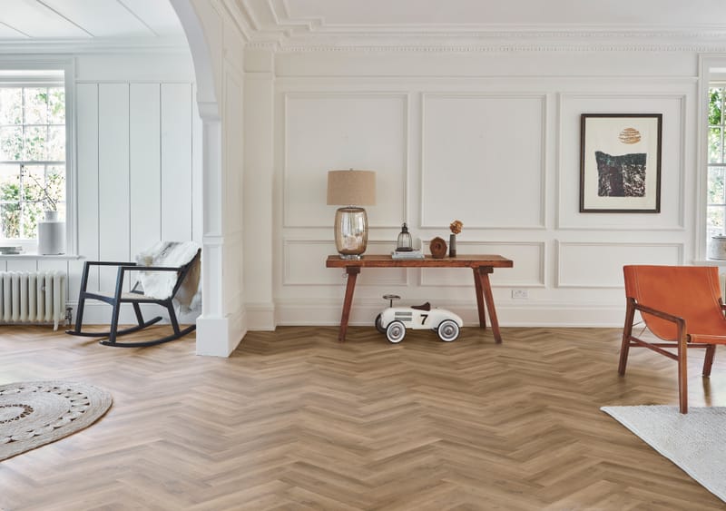 Herringbone floor tiles in a stylish hallway entrance with geometric pattern