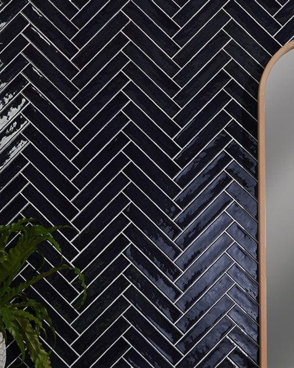 Traditional vertical herringbone tile layout drawing the eye upward