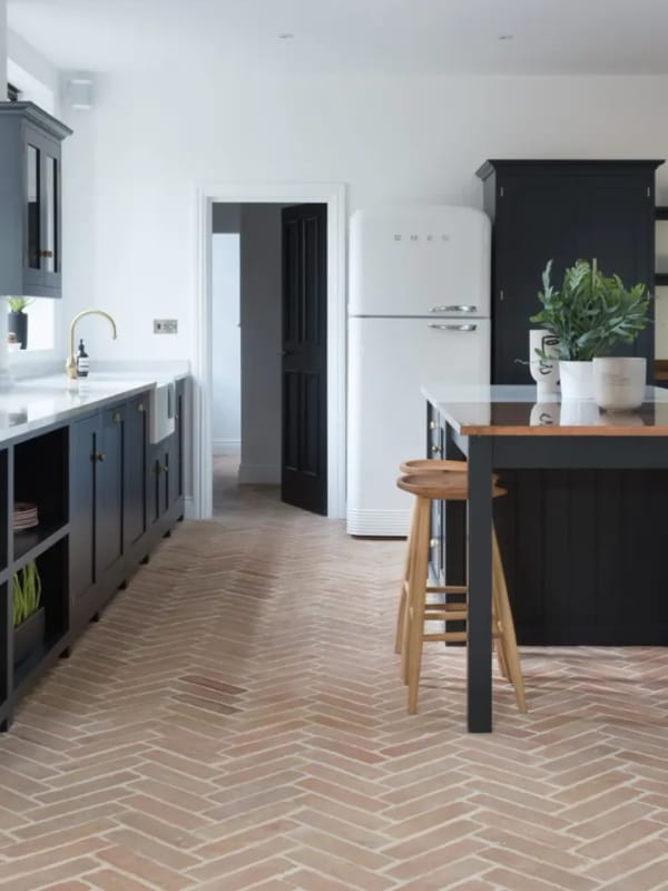 Prepared substrate surface ready for herringbone tile installation with levelling compound applied