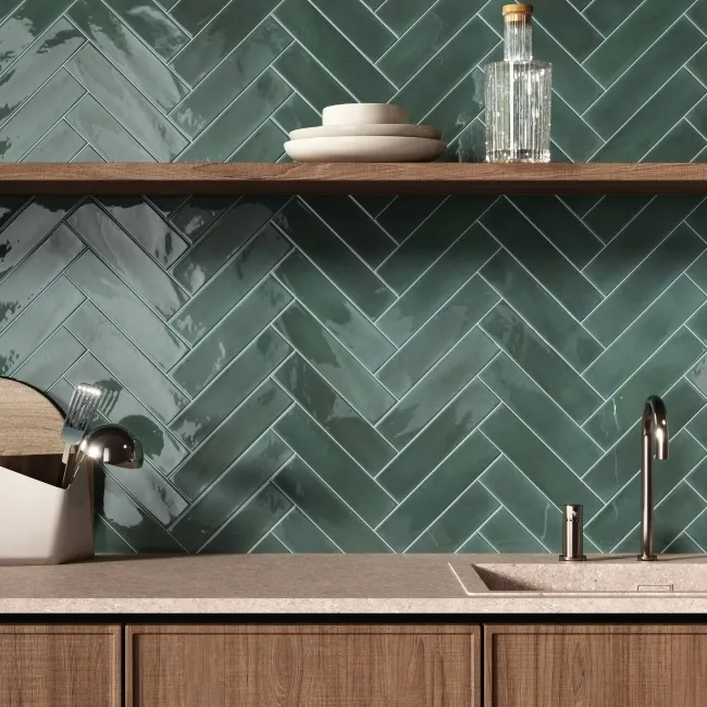 Emerald green herringbone tiles on bathroom feature wall behind vanity unit