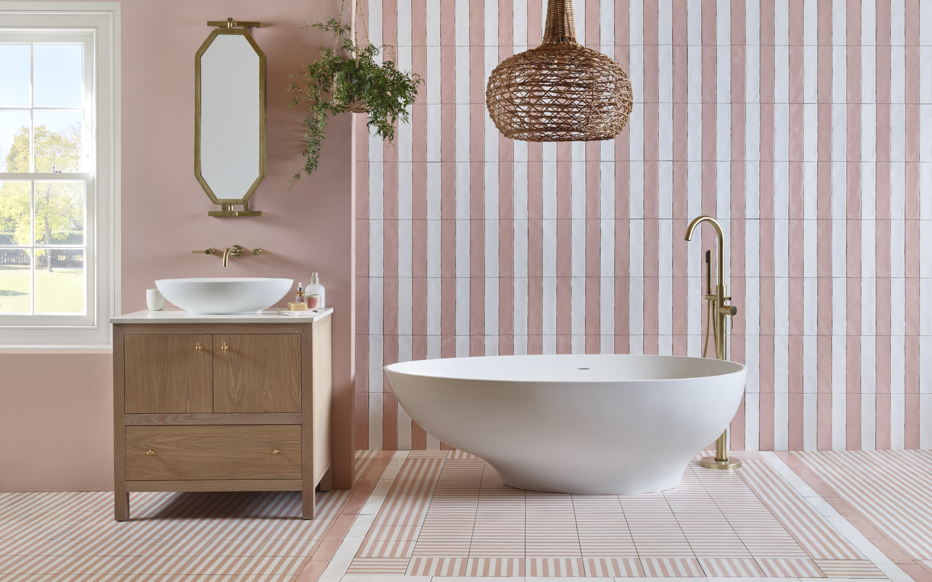 BC Designs freestanding bath with brass bath filler — Bowman Bathrooms designs and supplies both baths and walk-in showers, no preference either way