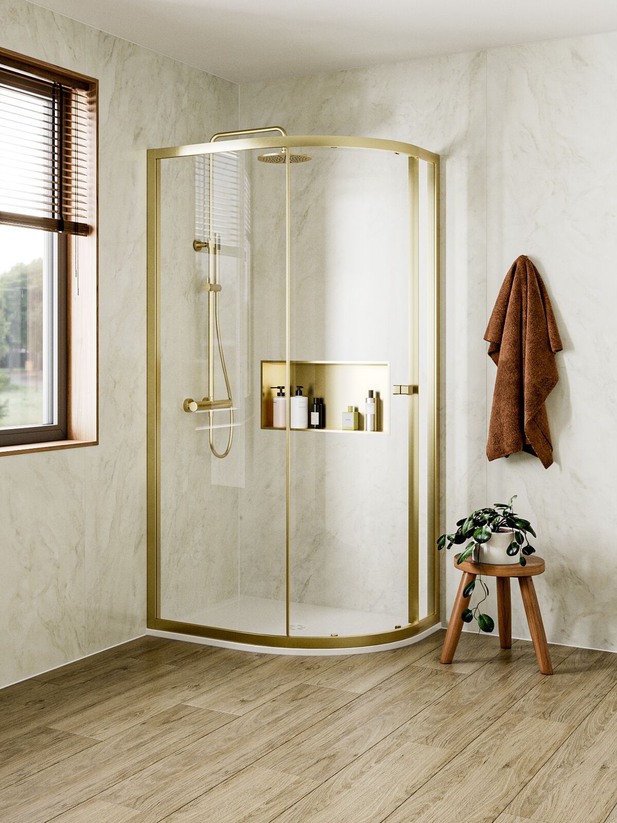 Crosswater offset quadrant shower enclosure in brushed brass, showing the curved front and the two unequal straight returns
