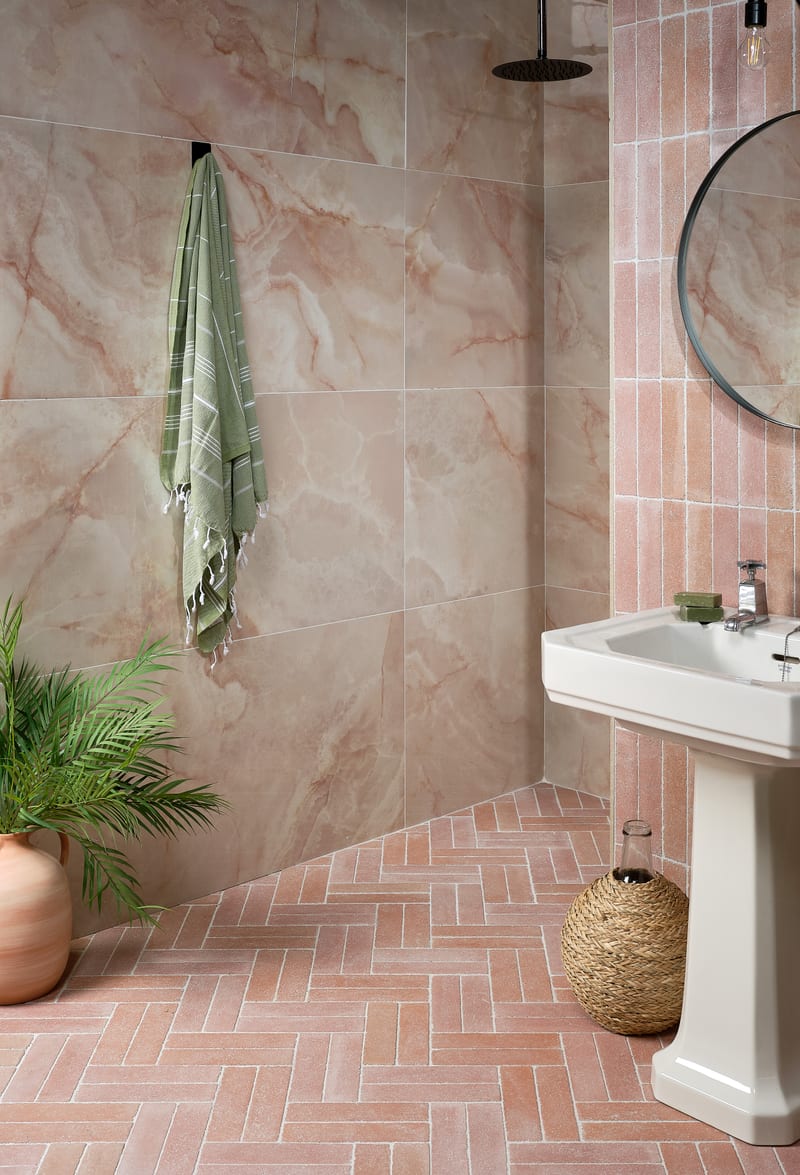 Peach and cotto-toned bathroom tiles showing layout variation across different room types