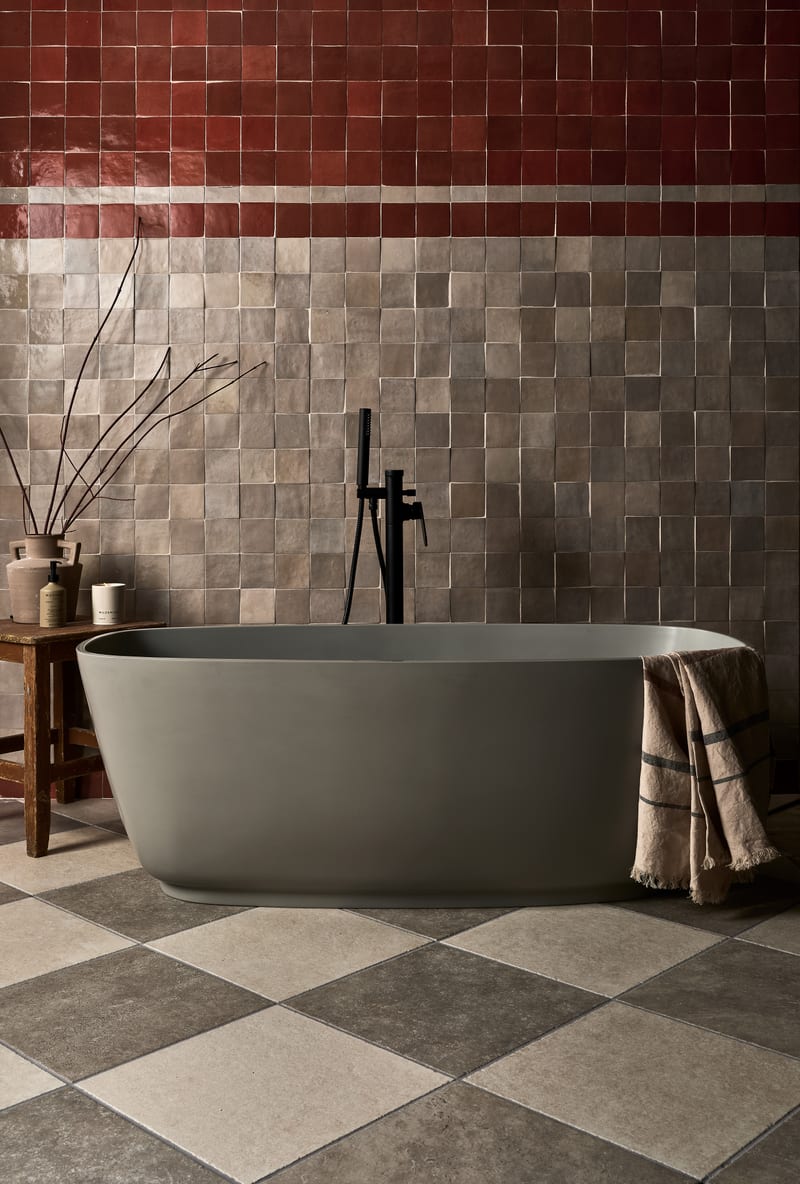 Luxury tiled bathroom with chequer pattern floor and decorative wall tiles showcasing layout impact