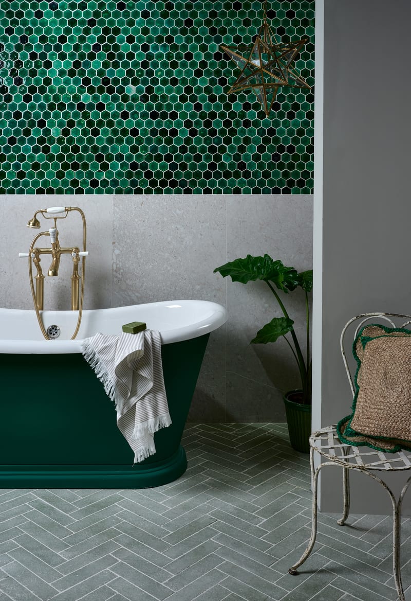 Contemporary bathroom with emerald wall tiles and contrasting floor layout demonstrating pattern variety