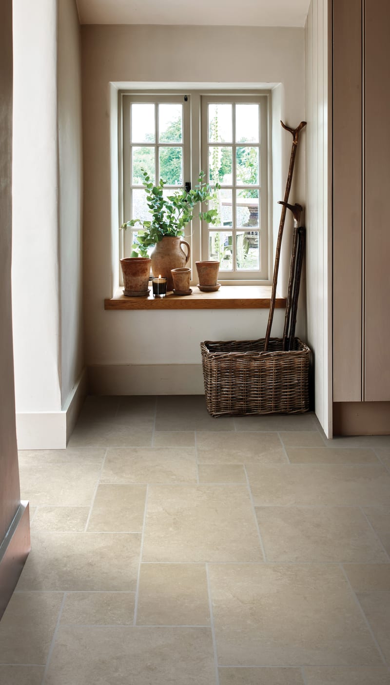 Pinwheel tile floor layout with beige porcelain tiles in geometric windmill pattern