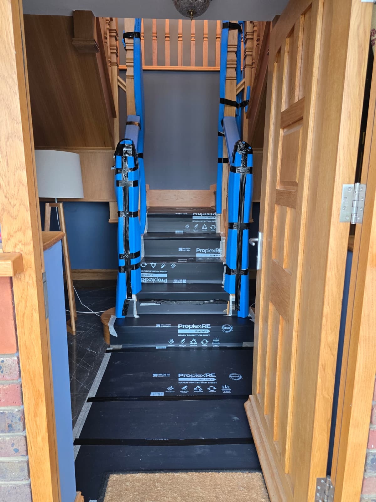 Professional bathroom installer protecting home during installation