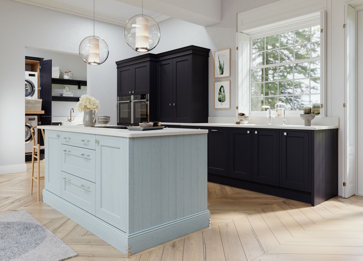 Traditional shaker kitchen with painted timber doors and brushed brass hardware at Bowmans Essex showroom