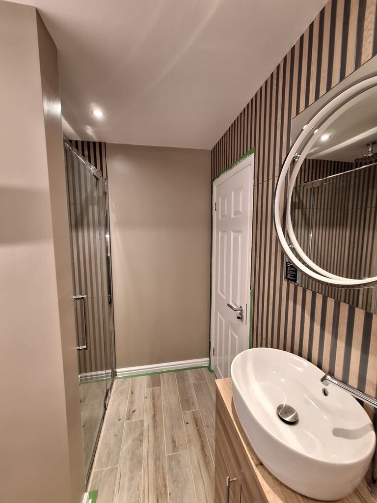 Crosswater frameless shower door, HiB Solas mirror and vessel basin in a Benfleet SS7 master ensuite