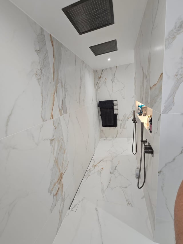 Walk-in double shower with marble tiling in a completed Billericay CM11 master ensuite