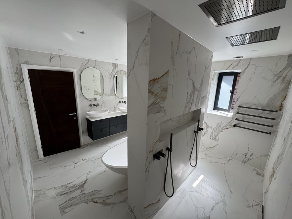 Billericay CM11 luxury master ensuite with marble-effect tiles and double vanity