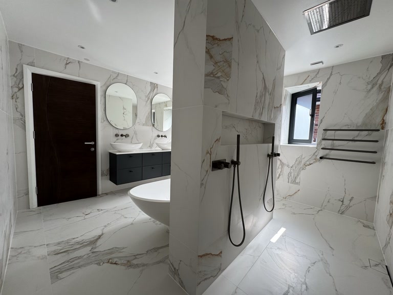 Billericay luxury master ensuite with dual showers by Bowmans