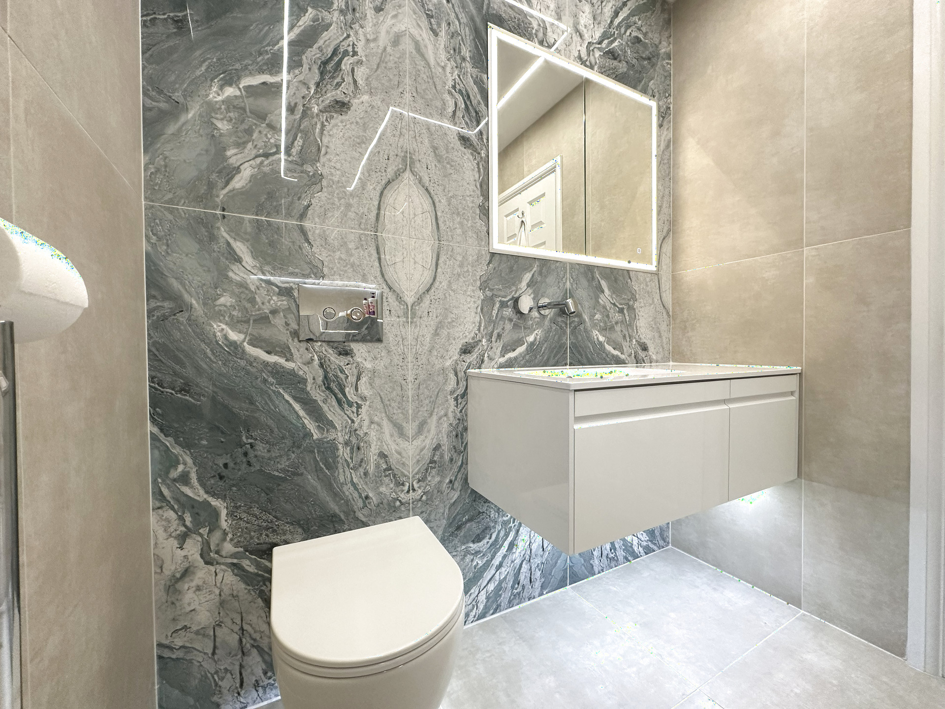 Braintree CM7 luxury ensuite wet room with Ca' Pietra Ocean Magnifique tiles, JTP chrome rainfall shower and an On The Level former
