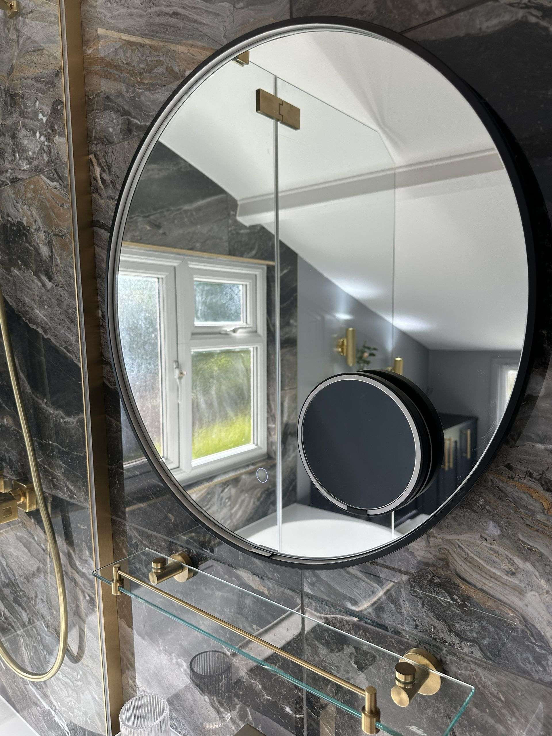 LED loop mirror with magnetic makeup mirror on Ca' Pietra Nero Magnifique bookmatched marble feature wall in Braintree CM7 bathroom