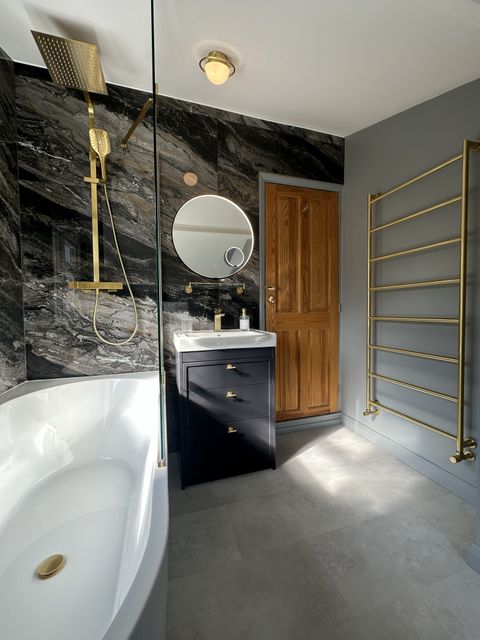 Practical bathroom surfaces and lighting designed for daily family use