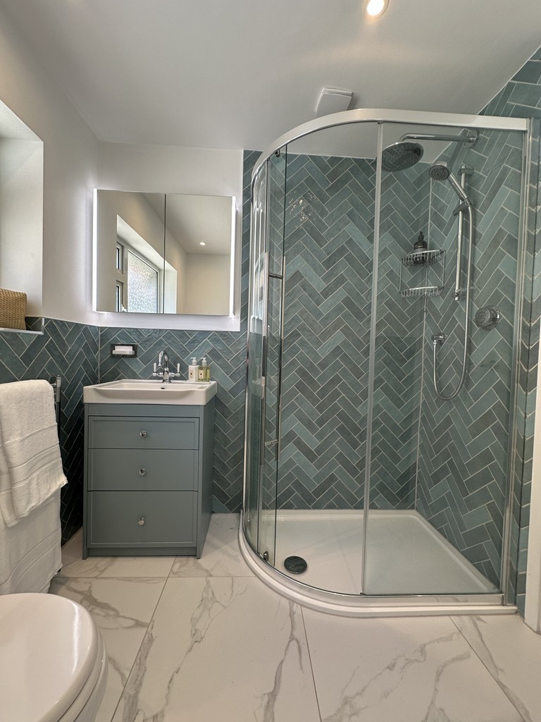 Brentwood CM13 family bathroom with herringbone tiles and chrome brassware