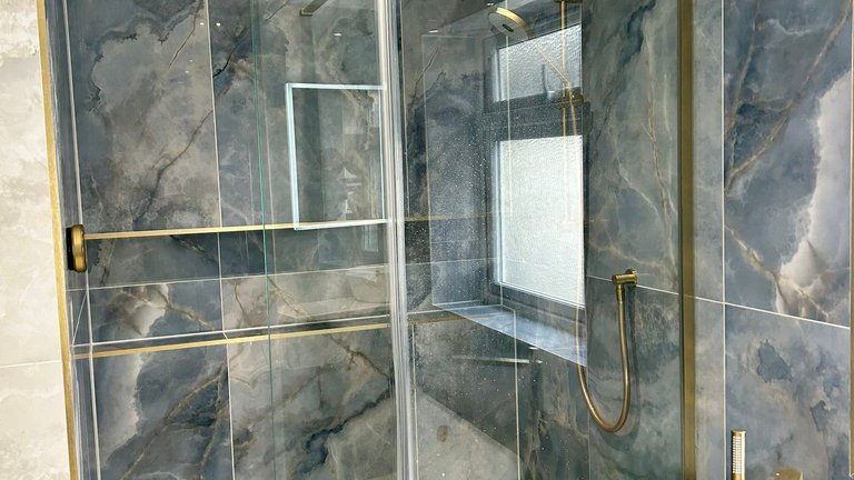Crosswater frameless wetroom glass with infinity niche and tileable linear waste Brentwood CM13 luxury bathroom