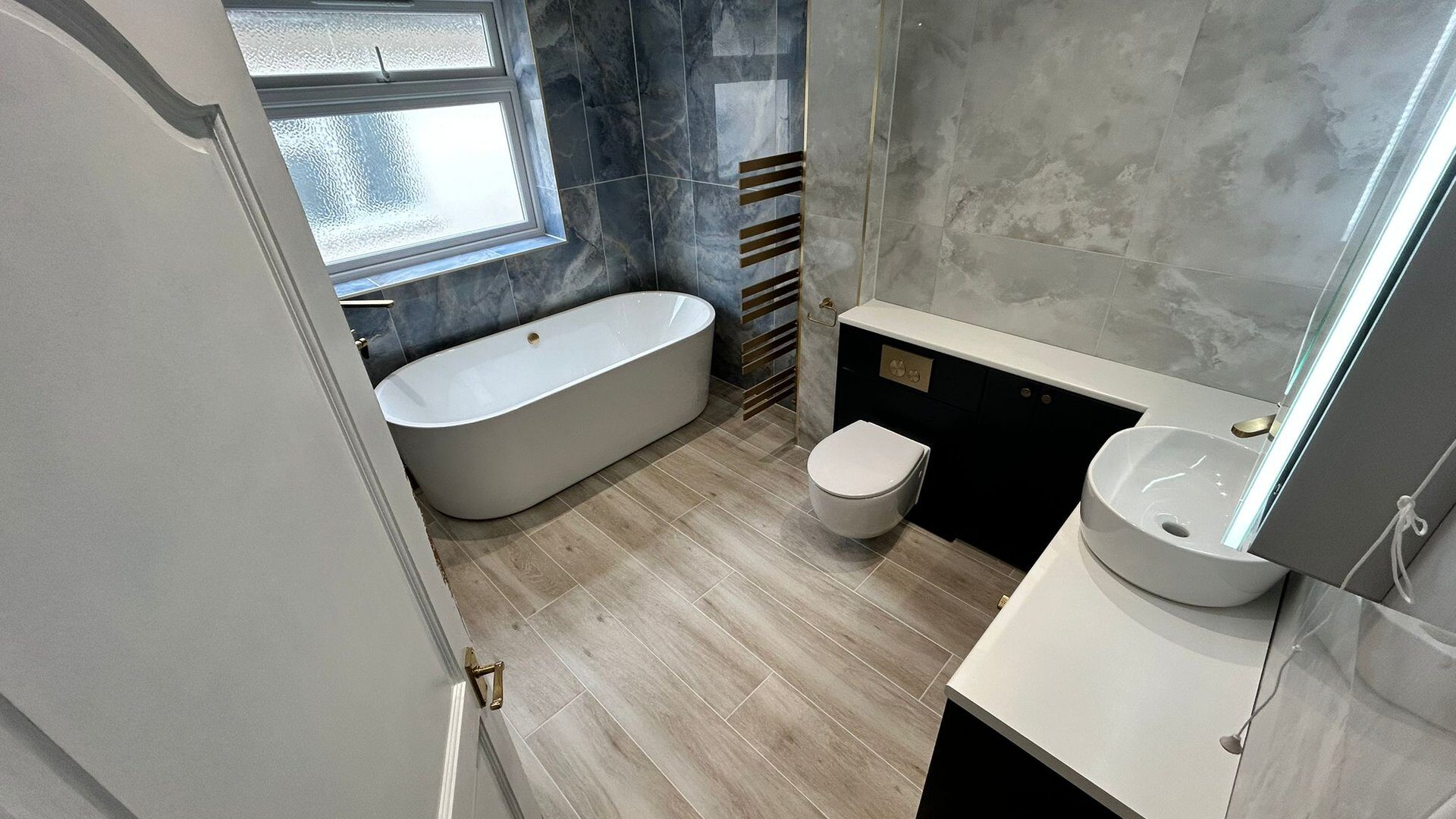 Luxury family bathroom Brentwood CM13 with Be Modern Atlanta furniture by Bowmans