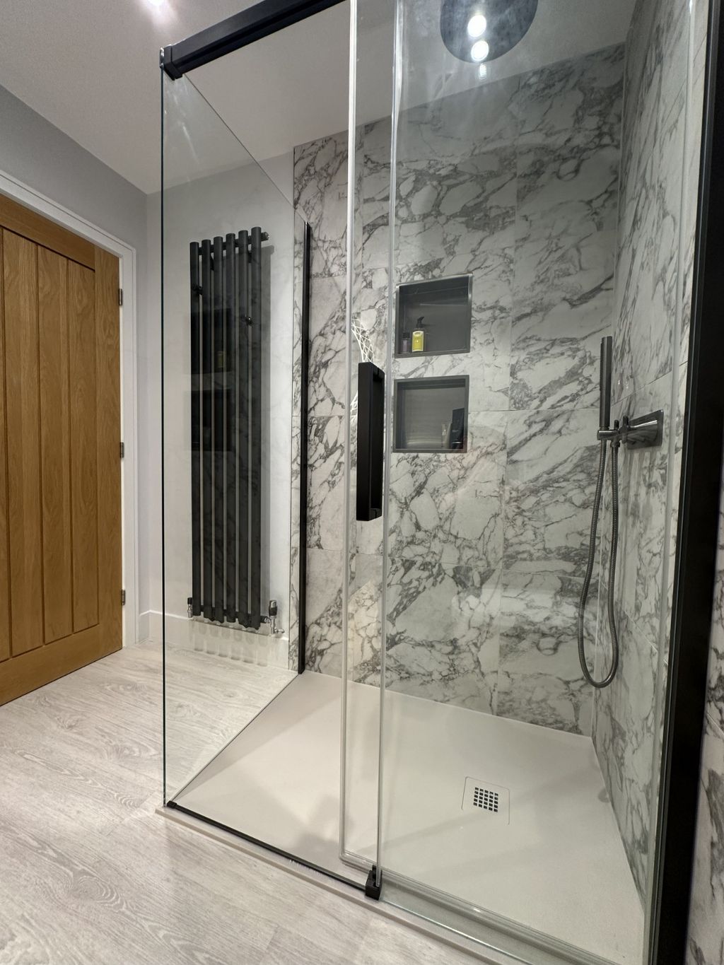 Crosswater Asura sliding shower door with Tissino Giorgio Lux grey slate tray and vertical radiator in Bures CO8