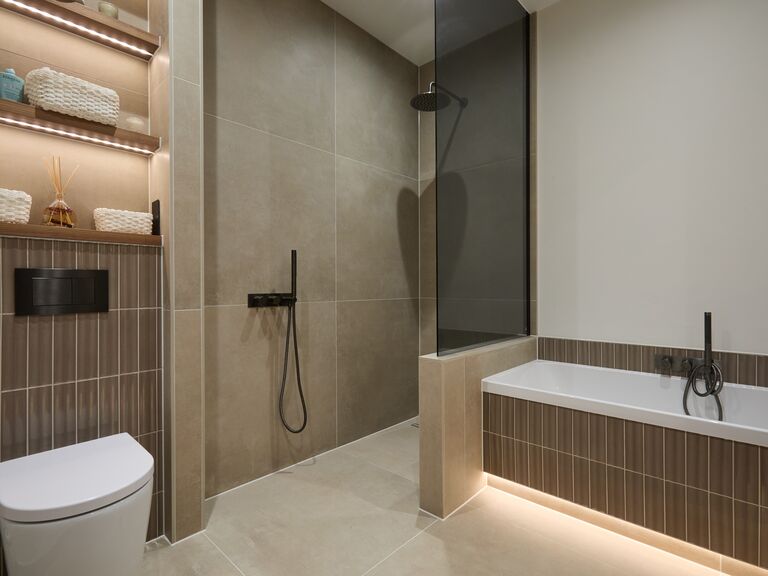 Family bathroom with back-to-wall WC level-access shower and fluted tile bath Chelmsford CM2 by Bowman Bathrooms