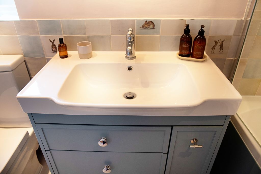 Roper Rhodes Halcyon chrome basin mixer on Academy basin with Coniston Blue vanity and Wiltshire Hares tiles Coggeshall CO6