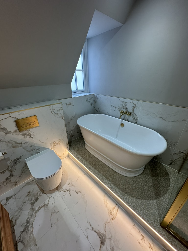 Overhead view of BC Designs freestanding bath WC and LED strip lighting Colchester CO1 family bathroom