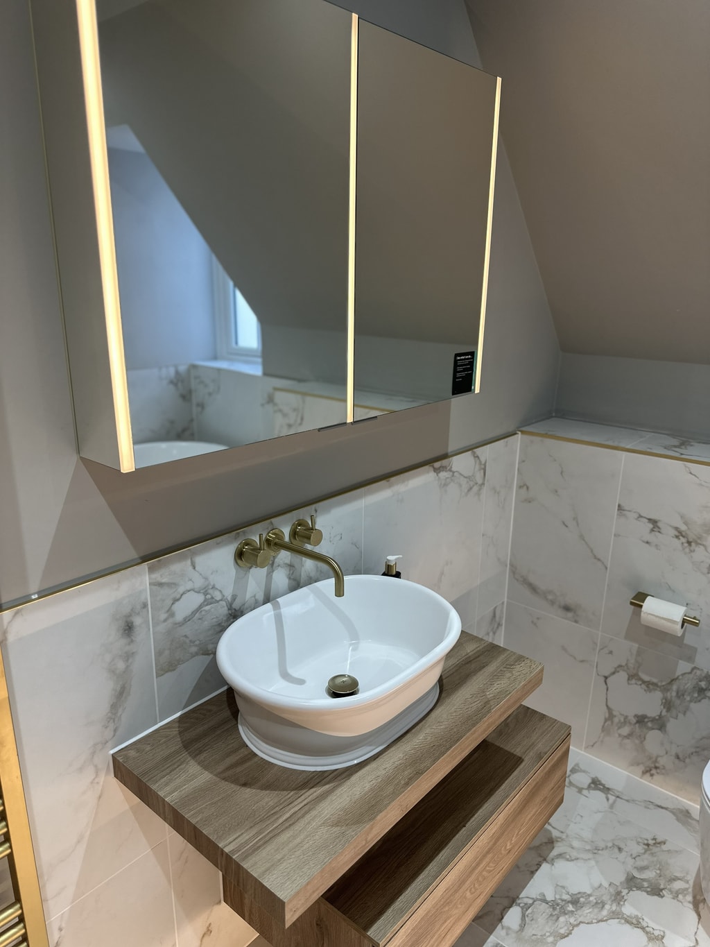 HiB Exos triple-panel mirrored cabinet with LED lighting above vessel basin Colchester CO1