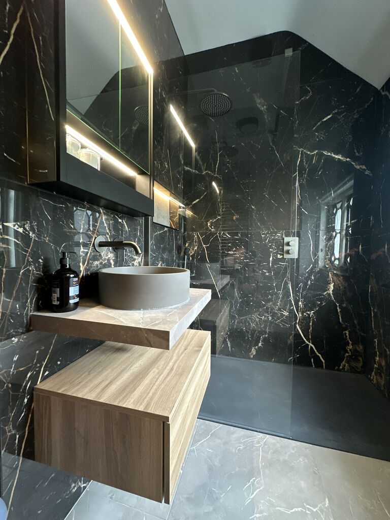 Oak-effect drawer unit with stone shelf and demisting mirror cabinet Gosfield CO9 Essex shower room