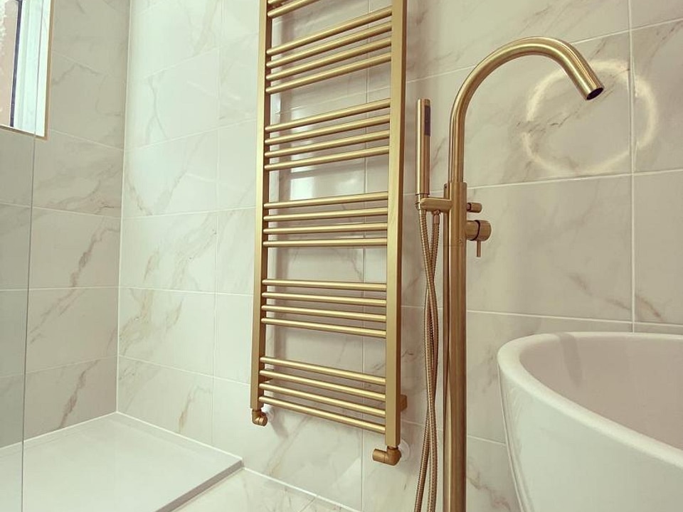 Brushed brass towel radiator and Crosswater MPRO freestanding bath filler Great Baddow CM2