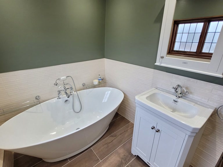 Completed family wetroom Great Bardfield CM6 BC Designs freestanding bath green walls rustic oak doors Bowmans