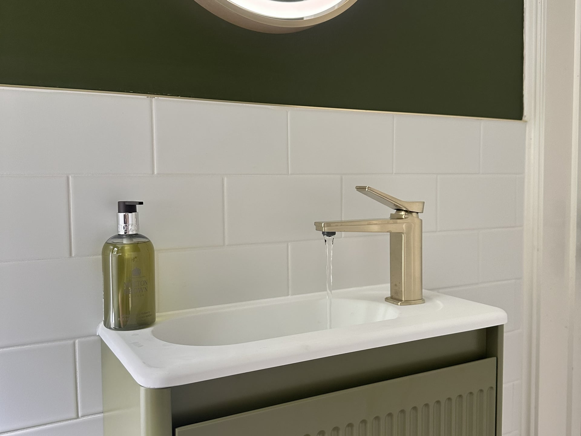 JTP Hix brushed brass basin mixer running water on HiB Adorn Olive vanity with Molton Brown hand wash Great Leighs CM3
