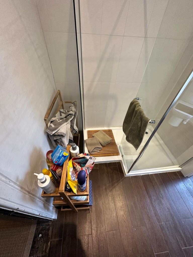 Cluttered shower corner before renovation heritage property Great Saling CM7
