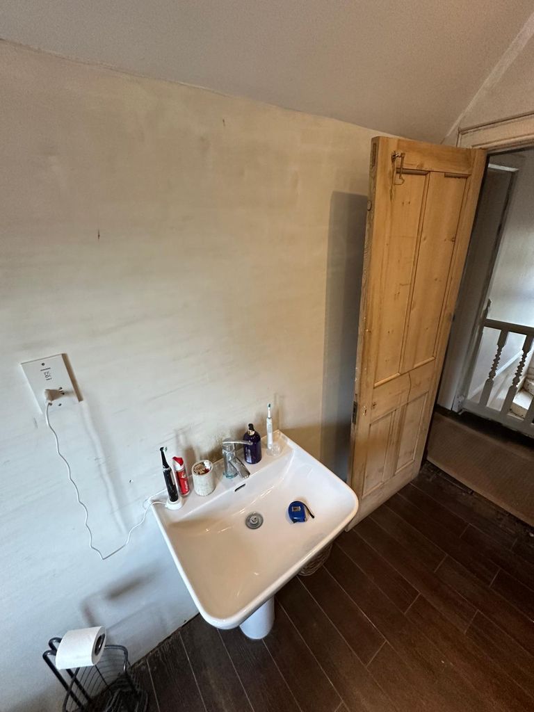 Pedestal basin wall before Concierge vanity installation Great Saling CM7